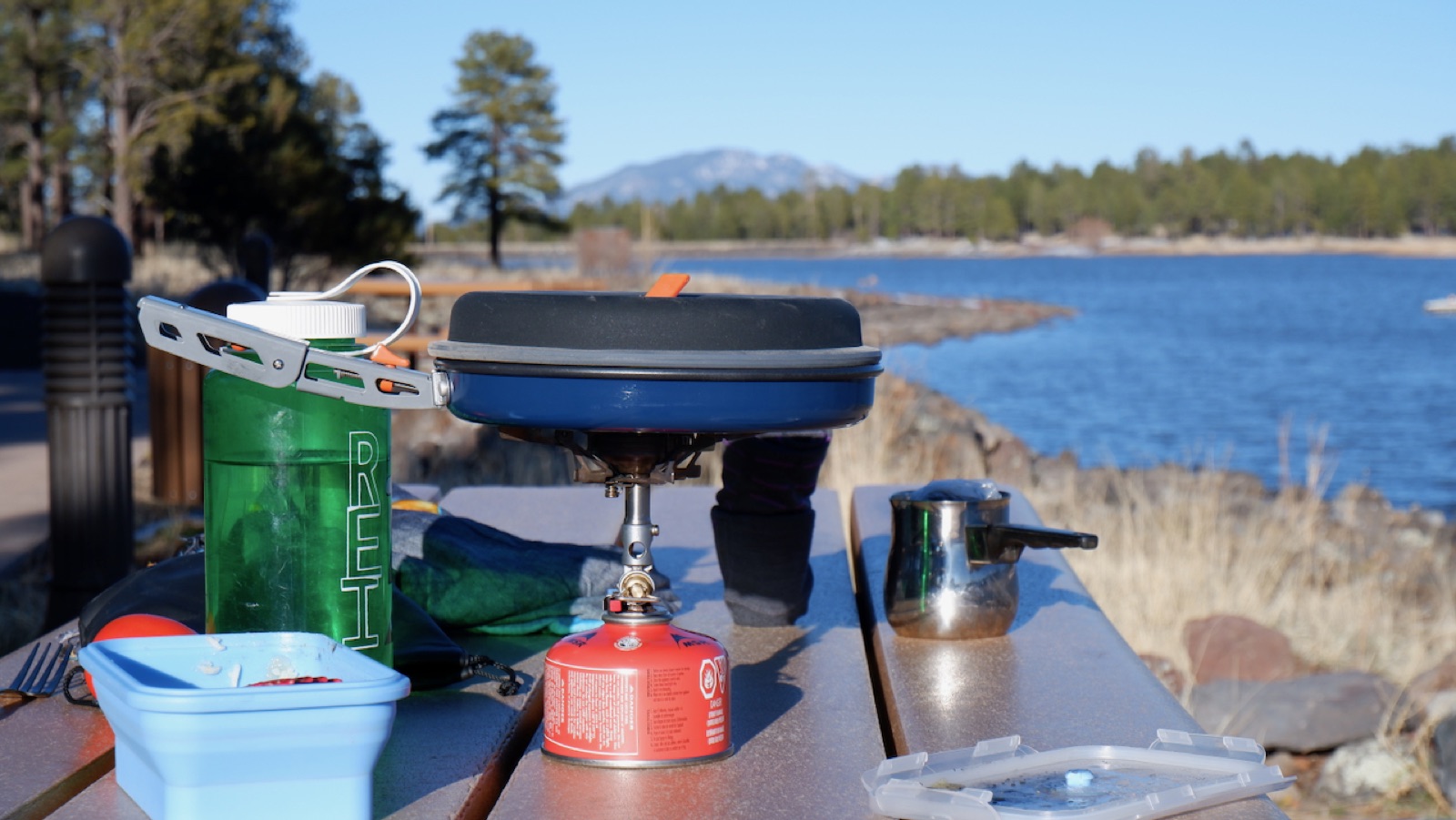Rice and hot dogs warming up on the portable stove